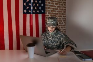 female-soldier-on-laptop-543987584-min